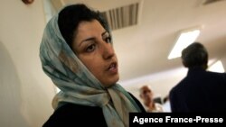 FILE - Iranian opposition rights activist Narges Mohammadi is seen at the Defenders of Human Rights Center in Tehran, Iran, June 25, 2007.