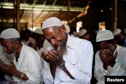 A Rohingya refugee cries during Eid al-Adha prayer in Kutupalong refugee camp in Cox’s Bazar, Bangladesh, Aug. 22, 2018.