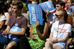 Audience members look on as Democratic presidential candidate, Sen. Bernie Sanders, I-Vt., speaks during a town hall meeting, Sept. 3, 2015, in Grinnell, Iowa.