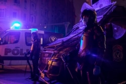 In this March 29, 2020 file photo, Egyptian security forces cordon off roads during curfew hours as prevention measures due to the coronavirus outbreak, in Cairo, Egypt. (AP Photo/Nariman El-Mofty, File)