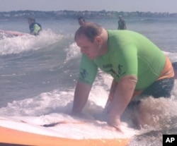 Matthew Fish - whose vision is so poor, he needs a cane to get around - learns to surf.