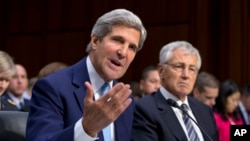 Secretary of State John Kerry, left, and Defense Secretary Chuck Hagel, right, appear before the Senate Foreign Relations Committee, Sept. 3, 2013, on Capitol Hill in Washington.