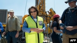 Cape Town City Mayor Patricia de Lille talks at a site where the city council has ordered drilling into the aquifer to tap water in Mitchells Plain, about 25km from the city center on January 11, 2018 in Cape Town.