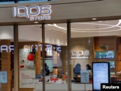 FILE - An iQOS store is pictured at Ginza in Tokyo, Japan, Dec. 18, 2017.