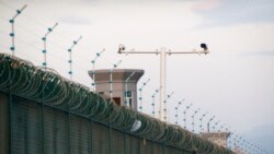 Security cameras are installed above the perimeter fence of what is officially known as a vocational skills education center in Dabancheng, in Xinjiang Uighur Autonomous Region, China, Sept. 4, 2018.
