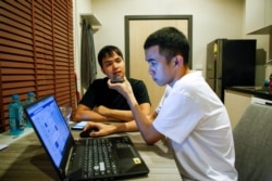 Tattep Ruangprakitseree and his partner Panumas Singprom, also a member of the commitee of Free People group, sit in a flat in Nonthaburi province, in Thailand August 22, 2020.