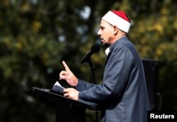 Imam Gamal Fouda leads a Friday prayer at Hagley Park outside al-Noor mosque in Christchurch, New Zealand, March 22, 2019.