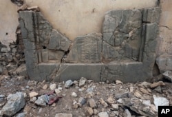 Carved stone slabs which were destroyed by Islamic State militants are seen at the ancient site of Nimrud, some 19 miles (30 kilometers) southeast of Mosul, Iraq, Nov. 16, 2016.