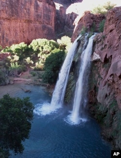 FILE - This 1997 file photo shows one of five waterfalls on Havasu Creek as its waters tumble 210 feet on the Havasupai Tribe's reservation in a southeastern branch of the Grand Canyon near Supai, Ariz.