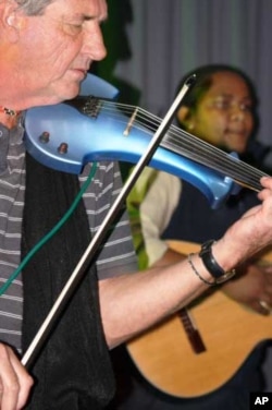 But it also adds instruments not easily associated with African music … One of its members is Lawrence Sisitska, originally from Hungary, who plays violin, mandolin and fiddle