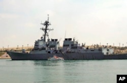 FILE - The U.S. destroyer USS Mason sails in the Suez canal in Ismailia, Egypt, on March 12, 2011. Two missiles fired from rebel-held territory in Yemen landed near the destroyer in the Red Sea.