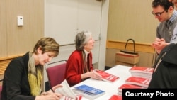 Betty Azar (right) and co-author Stacy Hagen sign books at the 2014 TESOL conference.