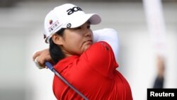 Yani Tseng of Taiwan hits her tee shot on the second hole during the second round of the British Women's Open Golf tournament at Royal Liverpool Golf Club, northern England, September 15, 2012.