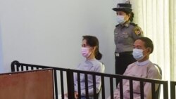 FILE - This handout photo taken May 24, 2021, and released by Myanmar's Ministry of Information May 26, shows detained civilian leader Aung San Suu Kyi (L) and detained president Win Myint (R) during their first court appearance in Naypyidaw.