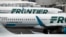 In this May 15, 2017, photo, Frontier Airlines jetliners sit at Denver International Airport in Denver.