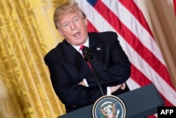 U.S. President Donald Trump attends a press conference at the White House in Washington, Jan. 10, 2018.