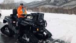 Masami Yashima, manager of Okushiga Kogen snow resort, sits on a snow quad in a parking lot in the winter season in Nagano, Japan, on January 25, 2020. (Reuters/Aaron Sheldrick)