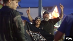 A Brazilian motocycle group celebrates at the end of the road.