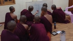 In this undated photo provided to The Associated Press in September 2021, monks gather to make a diagram of Obo Prison located in Mandalay, Myanmar.