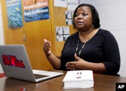 In this July 30, 2018 photo, Corinth High School English teacher Gennella Graham, a distant relative of William Roy Prather, explains the poem she wrote about her relative who was killed by a group of white teenagers on Halloween night, 1959.