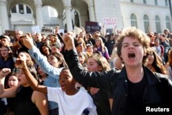 People gather to protest the election of Republican Donald Trump as the president of the United States outside of City Hall in Los Angeles, California, Nov. 9, 2016.