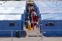 Afghan refugees are seen in an Italian Red Cross refugee camp, in Avezzano, Italy, Aug. 31, 2021.