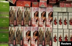FILE - Counterfeit perfumes are displayed at the Customs headquarters in Hong Kong, China, August 6, 2015.