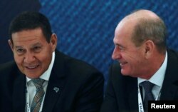 Brazil's Vice President Hamilton Mourao, left, and Brazil's Defense Minister Fernando Azevedo e Silva attend a conference during LAAD, the biggest military industry expo in Latin America, in Rio de Janeiro, April 2, 2019.