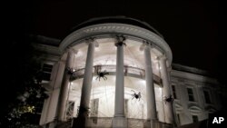 The White House in Washington, is decorated with spiders and web for Halloween, Oct. 28, 2017.