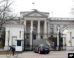 A taxi in front of the Russian Embassy in Warsaw, Poland, March 26, 2018.
