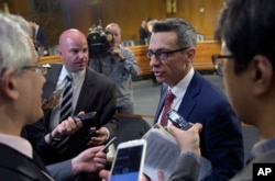 Clint Watts, a Senior Fellow at the Foreign Policy Research Institute Program on National Security, talks with reporters on Capitol Hill in Washington, March 30, 2017, following his testimony before the Senate Intelligence Committee hearing on Russian intelligence activities.