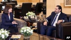 FILE - United States Ambassador to Lebanon Elizabeth Richard, left, speaks with Lebanese Prime Minister Saad Hariri, at the government House, in Beirut, Feb 19, 2019. Richard has expressed her country's concerns over the growing role of the militant Hezbollah.