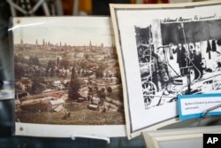 Images showing long-since disassembled oil derricks covering the land of 1920's New Straitsville is displayed at the New Straitsville History Group Museum, Thursday, Dec. 14, 2017, in New Straitsville, Ohio.