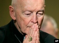 FILE - Cardinal Theodore McCarrick prays during the United States Conference of Catholic Bishops' annual fall assembly in Baltimore, Nov. 14, 2011.