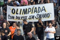 Police protest their pay in late June, just weeks before the opening of the Rio Olympics.