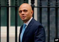 FILE - Government Cabinet Minister Sajid Javid arrives for a meeting at 10 Downing Street in London,Oct. 10, 2017.