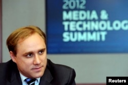 FILE - CrowdStrike co-founder and CTO Dmitri Alperovitch speaks during the Reuters Media and Technology Summit in New York, June 11, 2012.