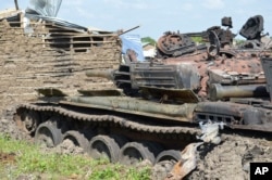 Tanks that have been destroyed during fighting between forces of Salva Kiir and Riek Machar, on July 10, 2016 in Jabel area of Juba, South Sudan, Saturday, July 16, 2016.