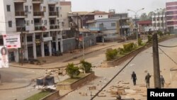 Soldiers clear a road in Bamenda, Cameroon, December 8, 2016.