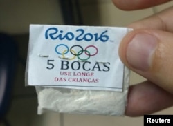 One of dozens of packages of cocaine stamped with a Rio 2016 label, the Olympic rings, and a warning that reads, "Keep away from children," confiscated by police in a raid on the Lapa neighborhood of Rio de Janeiro, July 25, 2016.