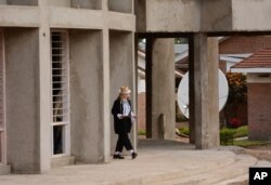FILE - Pop star Madonna visits the pediatric surgery and Malawi's first-ever intensive care unit under construction at Queen Elizabeth Central Hospital in the southern city of Blantyre, July 10, 2016.