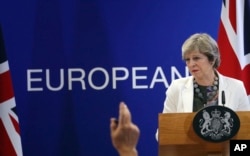 British Prime Minister Theresa May speaks during a media conference at an EU summit in Brussels, Oct. 20, 2017. European Union leaders gathered Friday to weigh progress in negotiations on Britain's departure.