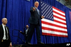 Republican presidential candidate Donald Trump arrives to speak at a campaign rally, Friday, Oct. 21, 2016, in Newtown, Pa.