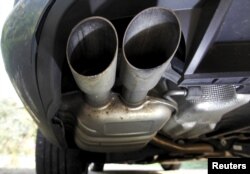 FILE - The exhaust system of a Volkswagen Passat TDI diesel car is seen in Esquibien, France, Sept. 23, 2015.