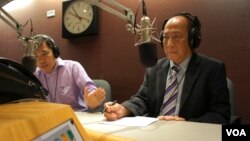 Mam Sonando took questions Monday by phone from the audience in Cambodia and through Facebook. He’s pictured here with the radio call-in program host, Men Kimseng. (Im Sothearith / VOA Khmer)
