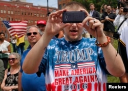 A supporter of Republican presidential candidate Donald Trump takes a picture at a pro-Trump rally near the Republican National Convention in Cleveland, Ohio. (Reuters)