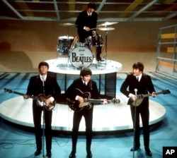 FILE - In this Feb. 9, 1964 file photo, The Beatles perform on the CBS "Ed Sullivan Show" in New York.