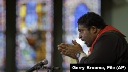 In this Wednesday, June 24, 2015 file photo, Rev. William Barber, president of the state chapter of the NAACP and architect of the protests known as “Moral Monday,” speaks during a Bible study at Pullen Memorial Baptist Church in Raleigh, N.C.