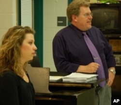 Sarah Pramstaller, choreographer, and Glenn Cockrell, musical director, work as a team during rehearsal.