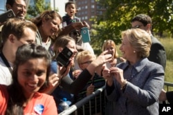 Democratic presidential candidate Hillary Clinton greets attendees during a campaign stop in Des Moines, Iowa, Sept. 29, 2016.